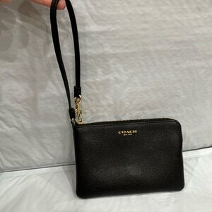 Coach mini wristlet.  6” x 4” used a couple times.